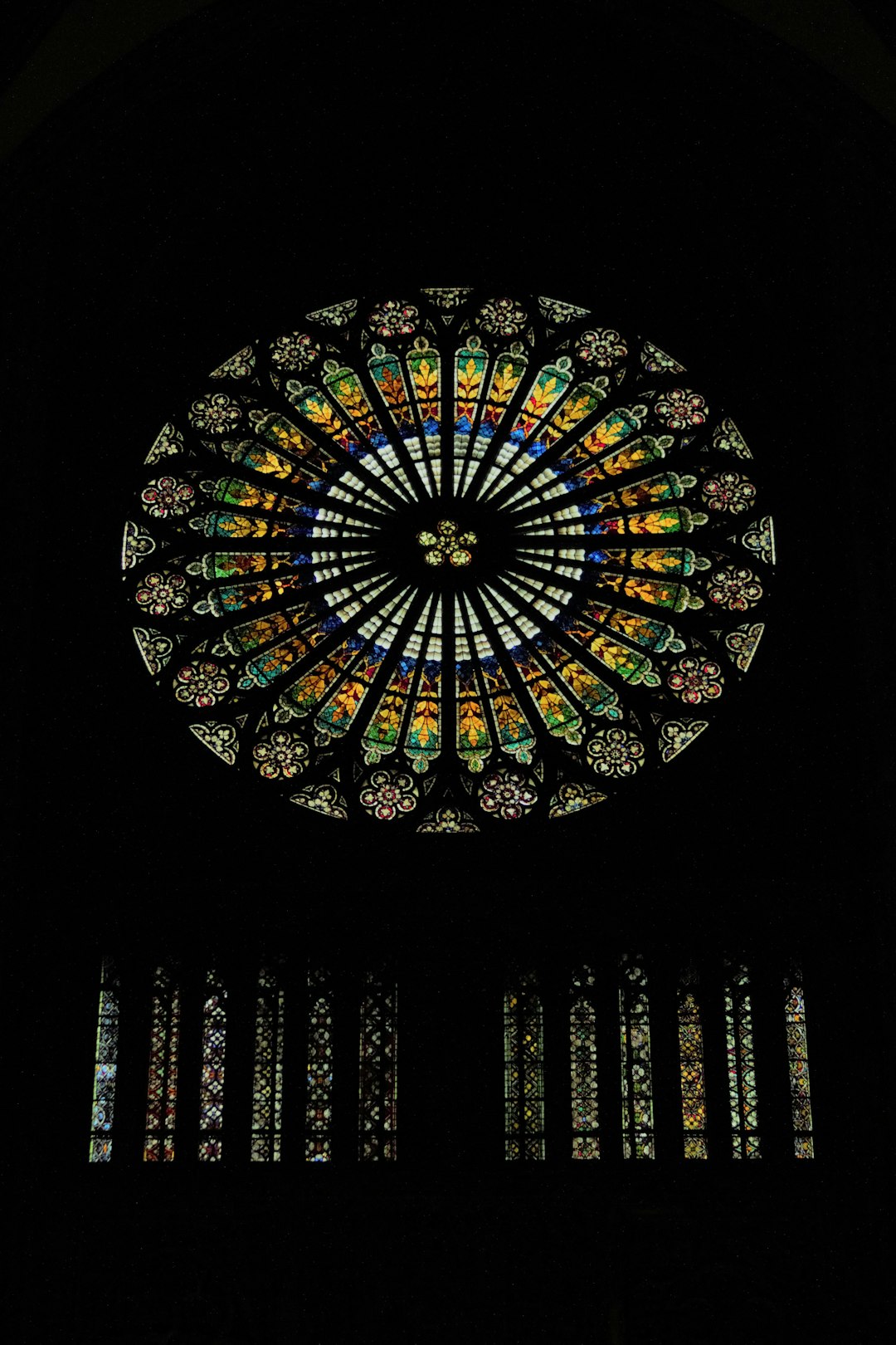 Chartres Cathedral rose window with intricate stone tracery and cobalt blue glass